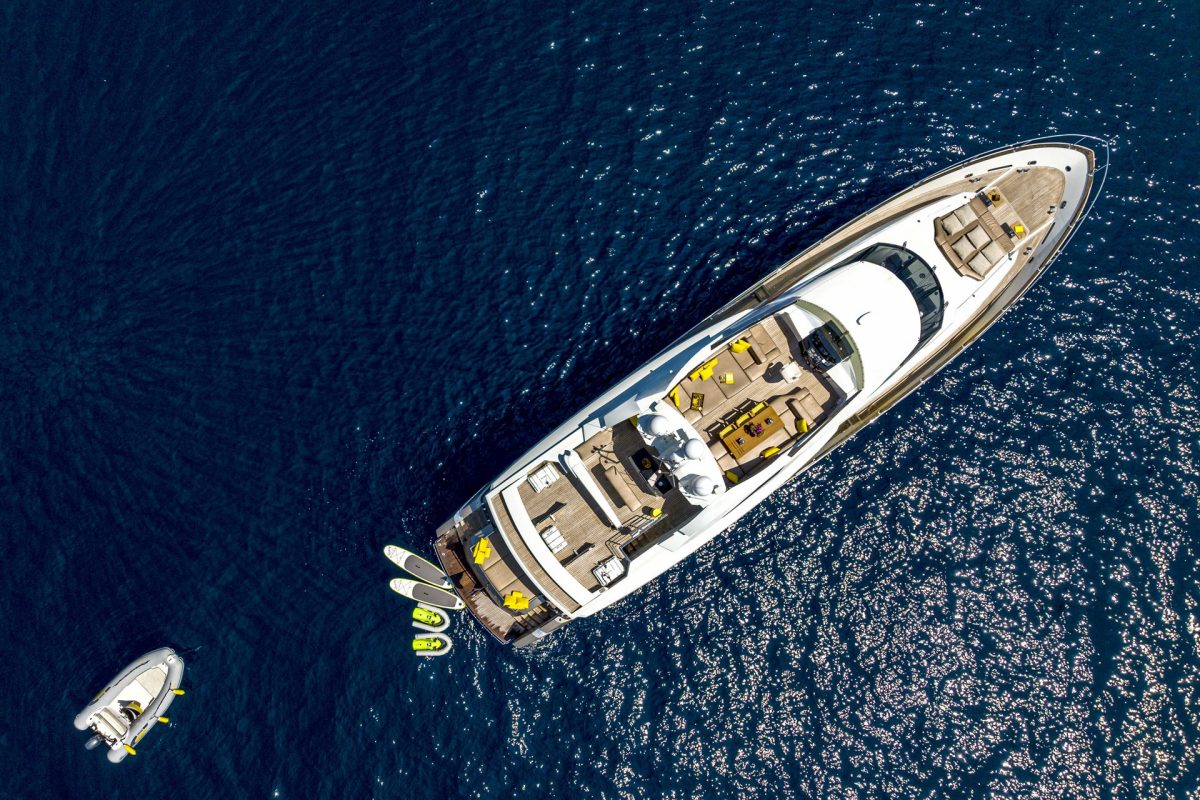 Aerial view of QUANTUM, Peri Yachts, with her tender and water toys on the sea